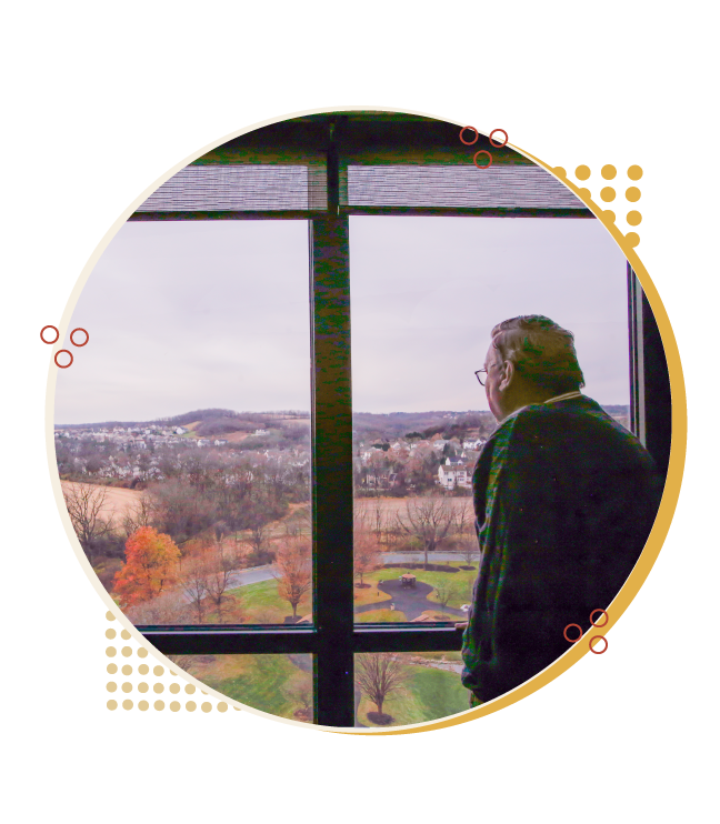 man looking out the window